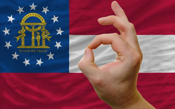 Ok gesto frente a Georgia nos bandera del estado — Foto de Stock
