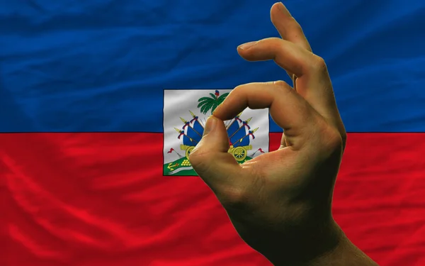 Ok gesture in front of haiti national flag — Stock Photo, Image