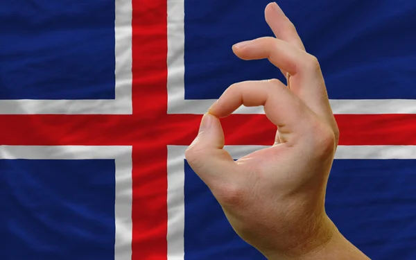 Ok gesture in front of iceland national flag — Stockfoto