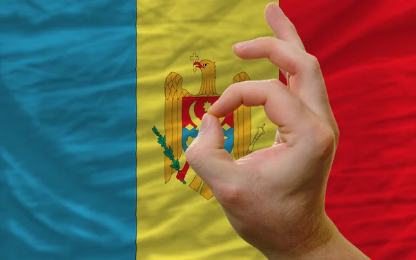 OK gest framför Moldavien flagga — Stockfoto