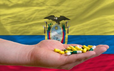 Holding, el Ekvador bayrağı haplar