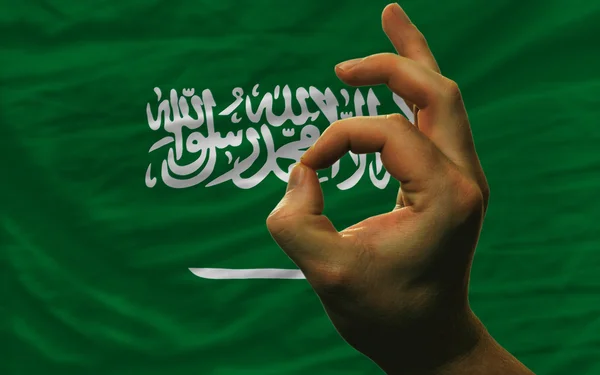 Ok gesto en frente de Arabia Saudita bandera nacional —  Fotos de Stock