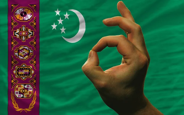 Ok gesture in front of turkmenistan national flag — Stock Photo, Image