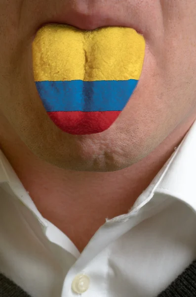 Lengua de hombre pintada en bandera de Colombia que simboliza el conocimiento a —  Fotos de Stock