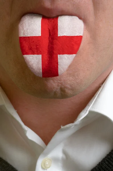 Männerzunge in englische Flagge gemalt, die das Wissen symbolisiert — Stockfoto