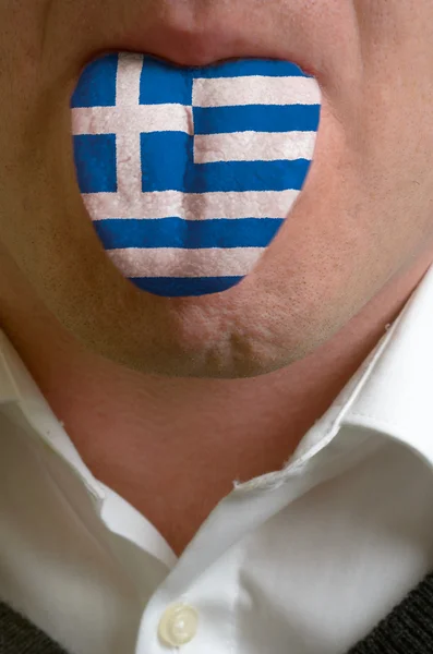 Uomo lingua dipinta in bandiera greca che simboleggia alla conoscenza di sp — Foto Stock