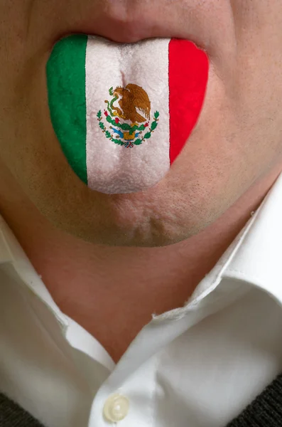 Man tongue painted in mexico flag symbolizing to knowledge to sp — Stock Photo, Image