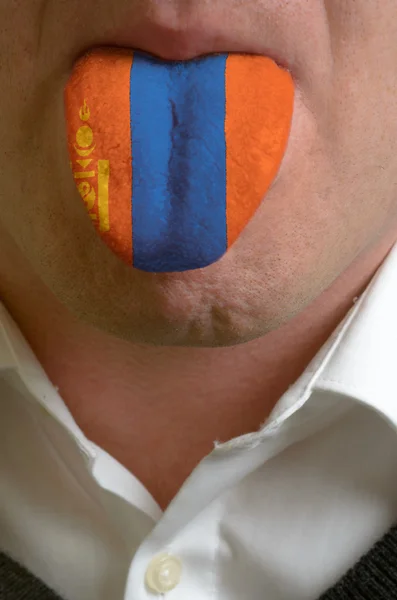 Man tongue painted in mongolia flag symbolizing to knowledge to — Stock Photo, Image