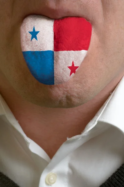 Man tongue painted in panama flag symbolizing to knowledge to sp — Stock Photo, Image