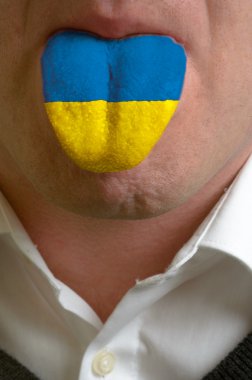 man tongue painted in ukraine flag symbolizing to knowledge to s clipart