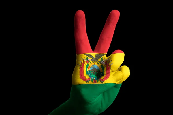 Boliwia flagi narodowej dwóch palcem gest zwycięstwa i winn — Zdjęcie stockowe