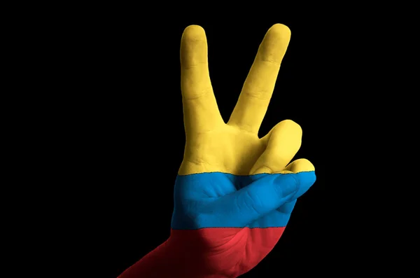 Colombia national flag two finger up gesture for victory and win — Stock Photo, Image