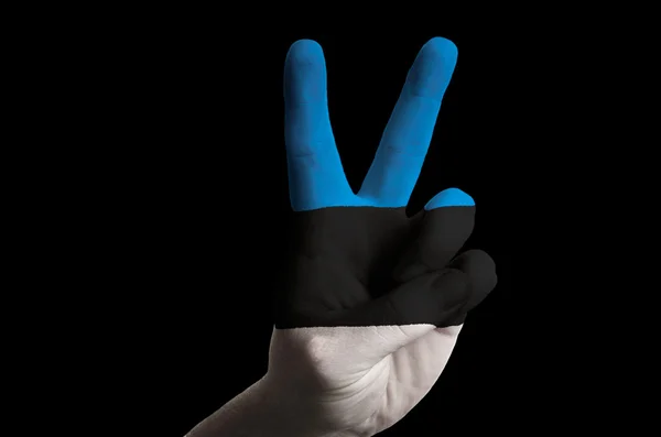 Estonia national flag two finger up gesture for victory and winn — Stock Photo, Image