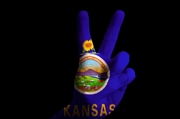 Kansas us state flag two finger up gesture for victory and winne — Stock Photo, Image