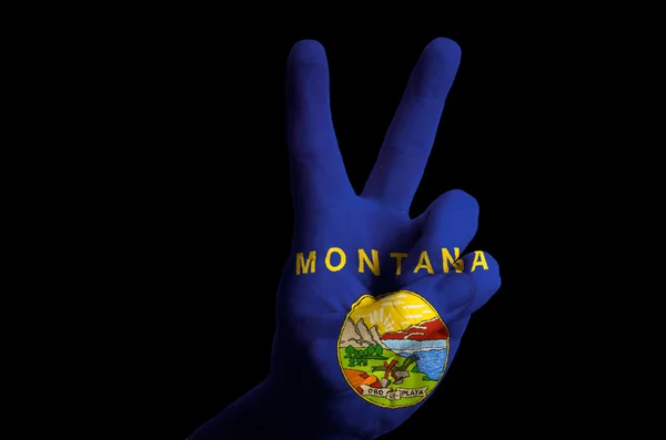 Montana us state flag two finger up gesture for victory and winn — Stock Photo, Image