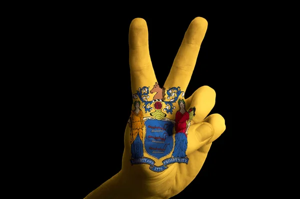 New jersey us state flag two finger up gesture for victory and w — Stock Photo, Image