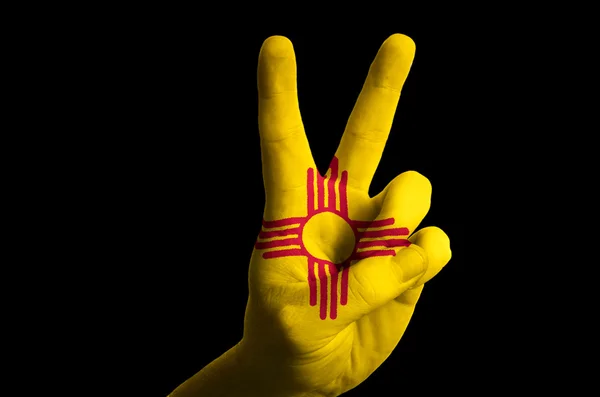 New mexico us state flag two finger up gesture for victory and w — Stock Photo, Image