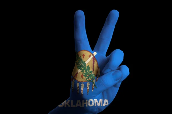 Oklahoma us state flag two finger up gesture for victory and win — Stock Photo, Image