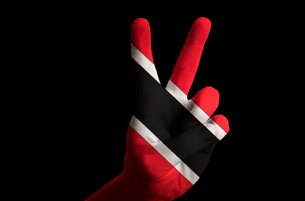 Trinidad tobago nationella flagga två finger upp gest för seger — Stockfoto