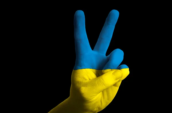Ukraina nationella flagga två finger upp gest för seger och winn — Stockfoto