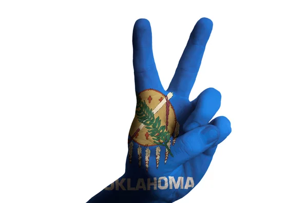 Oklahoma us state flag two finger up gesture for victory and win — Stock Photo, Image