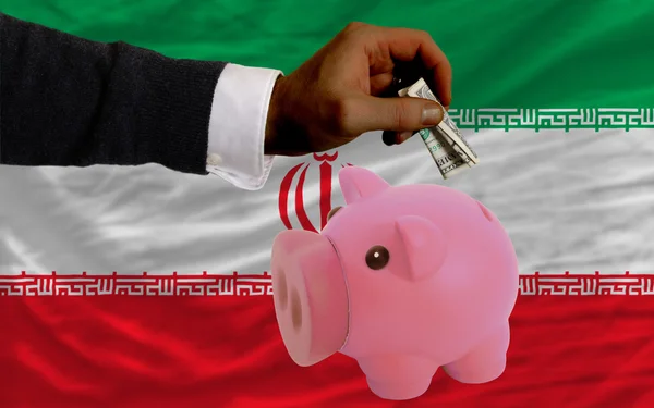 Dollar till rika piggy bank och nationella flagga iran — Stockfoto