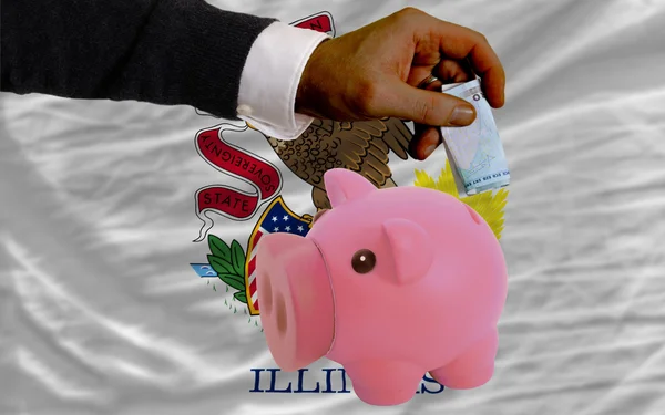 Funding euro into piggy rich bank flag of american state of illi — Stock Photo, Image