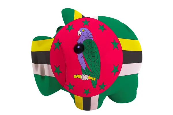 Rika piggy bank i färger nationella flagga dominica för savi — Stockfoto