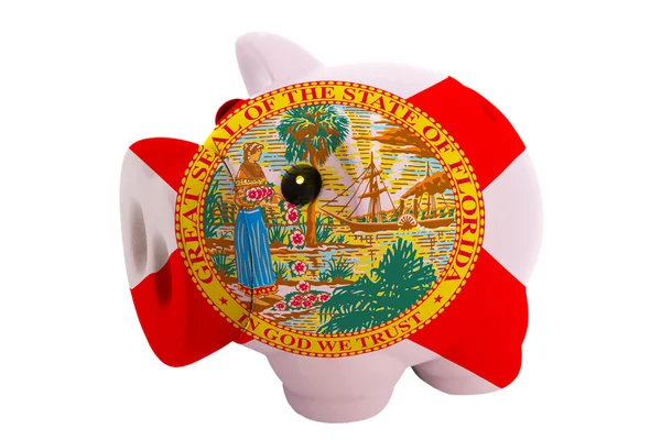 Rika piggy bank i färger flagga amerikanska delstaten florida — Stockfoto