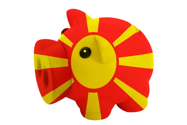 Prasátko bohaté banka v barvách národní vlajka Makedonie pro sav — Stock fotografie