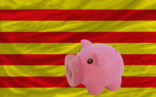 Piggy rich bank and national flag of of catalonia — Stock Photo, Image