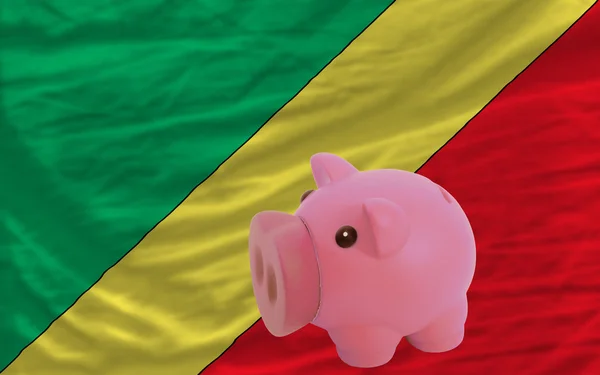Tirelire riche et drapeau national de du congo — Photo