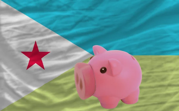 Piggy rich bank and national flag of of djibuti — Stock Photo, Image