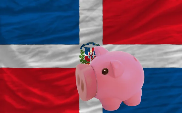 Rika piggy bank och nationella flagga Dominikanska — Stockfoto