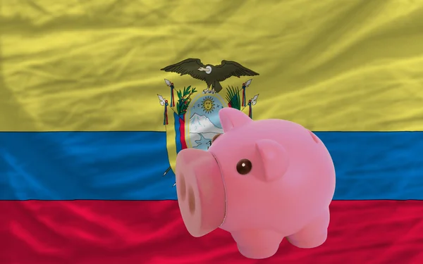 Piggy rich bank and national flag of ecuador — Stock Photo, Image