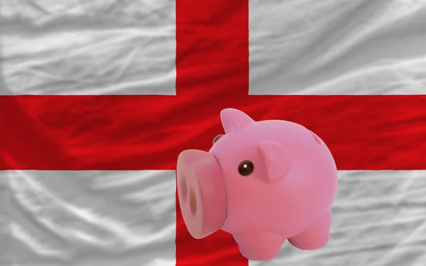 Prasátko bohaté banky a státní vlajka Anglie — Stock fotografie