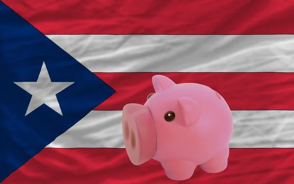 Piggy rich bank and national flag of puertorico — Stock Photo, Image