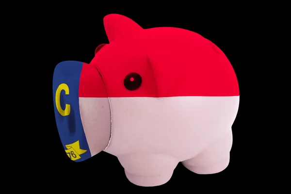 Piggy rich bank in colors flag of american state of north caroli — Stock Photo, Image
