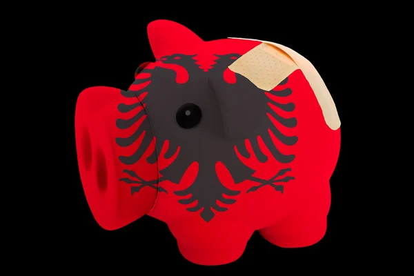 Upadłości piggy bank bogate kolory flagi narodowej w Albanii — Zdjęcie stockowe