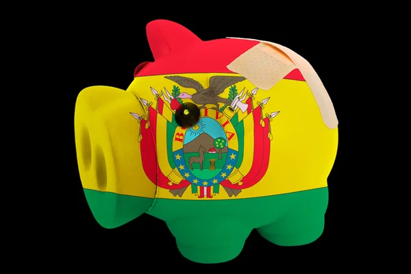 Bankrupt piggy rich bank in colors of national flag of bolivia — Stock Photo, Image