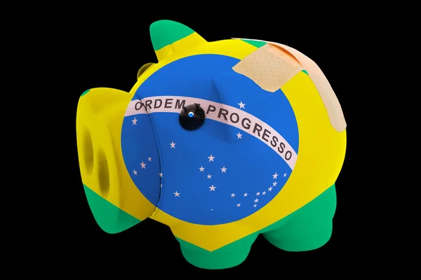 Úpadku prasátko bohaté banky v barvách národní vlajka Brazílie — Stock fotografie