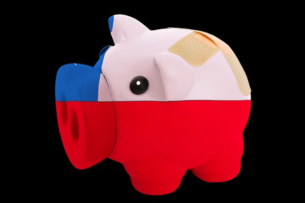 Failliete piggy rijke bank in de kleuren van de nationale vlag van Chili — Stockfoto