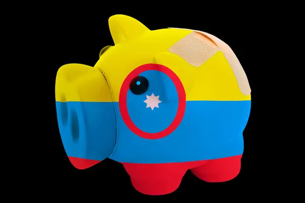 Bankrupt piggy rich bank in colors of national flag of columbia — Stock Photo, Image