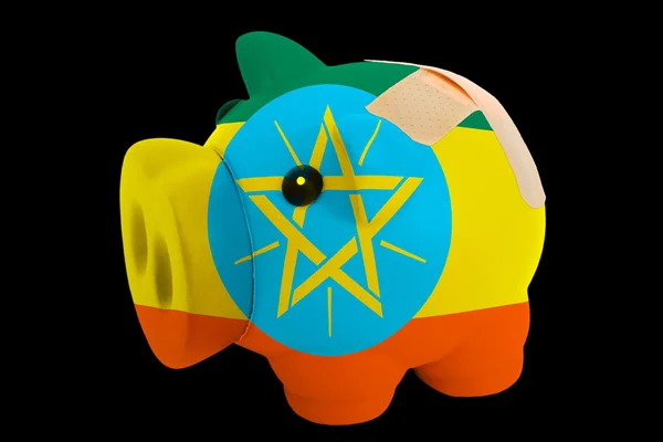 破产猪富国银行在埃塞俄比亚国旗的颜色 — 图库照片