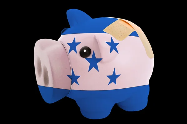 Bankrupt piggy rich bank in colors of national flag of honduras — Stock Photo, Image