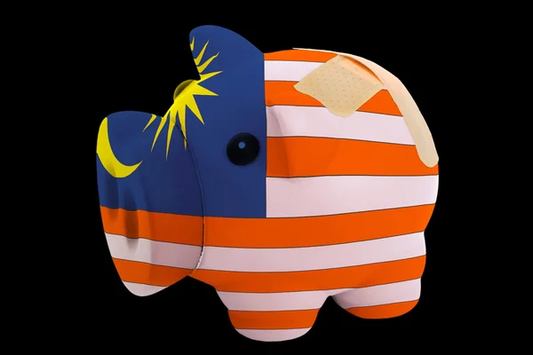Bankrottes Sparschwein in den Farben der malaysischen Nationalflagge — Stockfoto