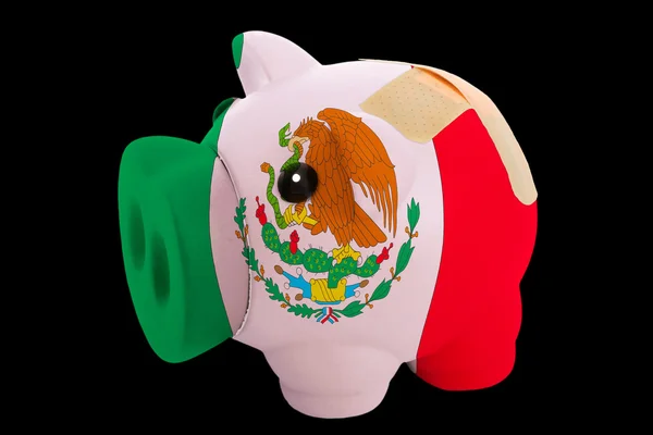 Bankrupt piggy rich bank in colors of national flag of mexico — Stock Photo, Image