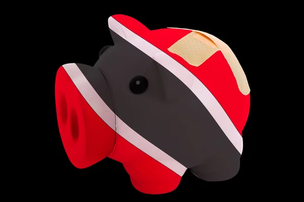 Bankrupt piggy rich bank in colors of national flag of trinidad — Stock Photo, Image