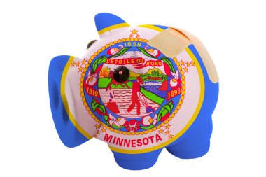 Amerikan s renkler bayrağı bandaj ile kapalı piggy zengin banka