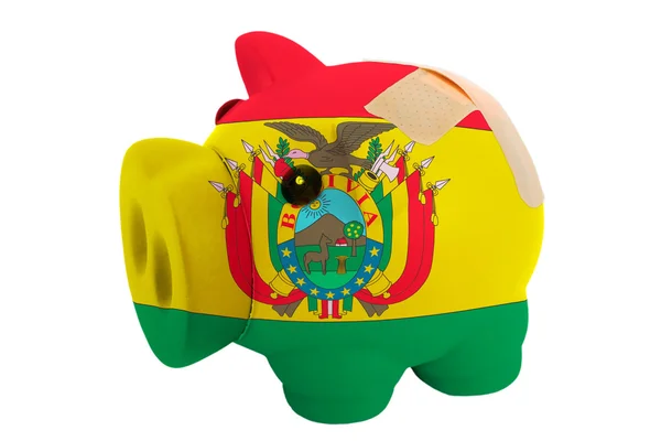 Closed piggy rich bank with bandage in colors national flag of b — Stock Photo, Image